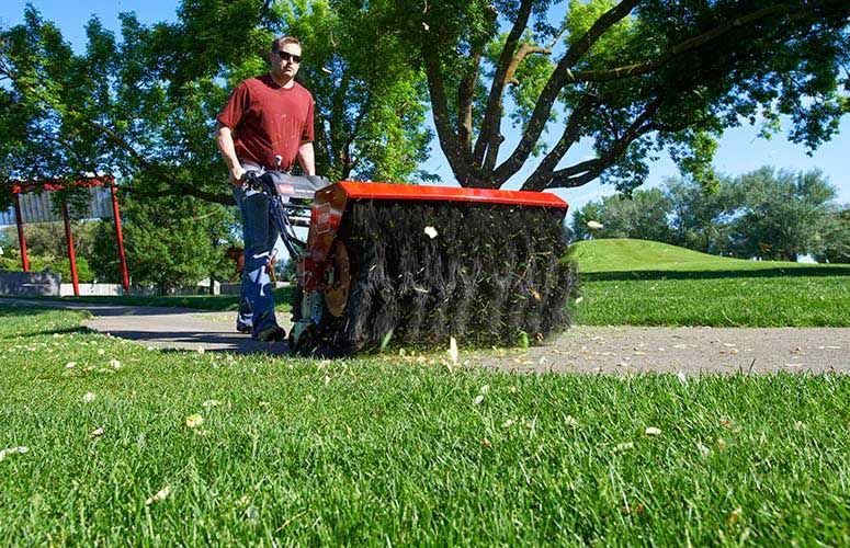 Toro Power Broom easily brushes away grass clippings and debris